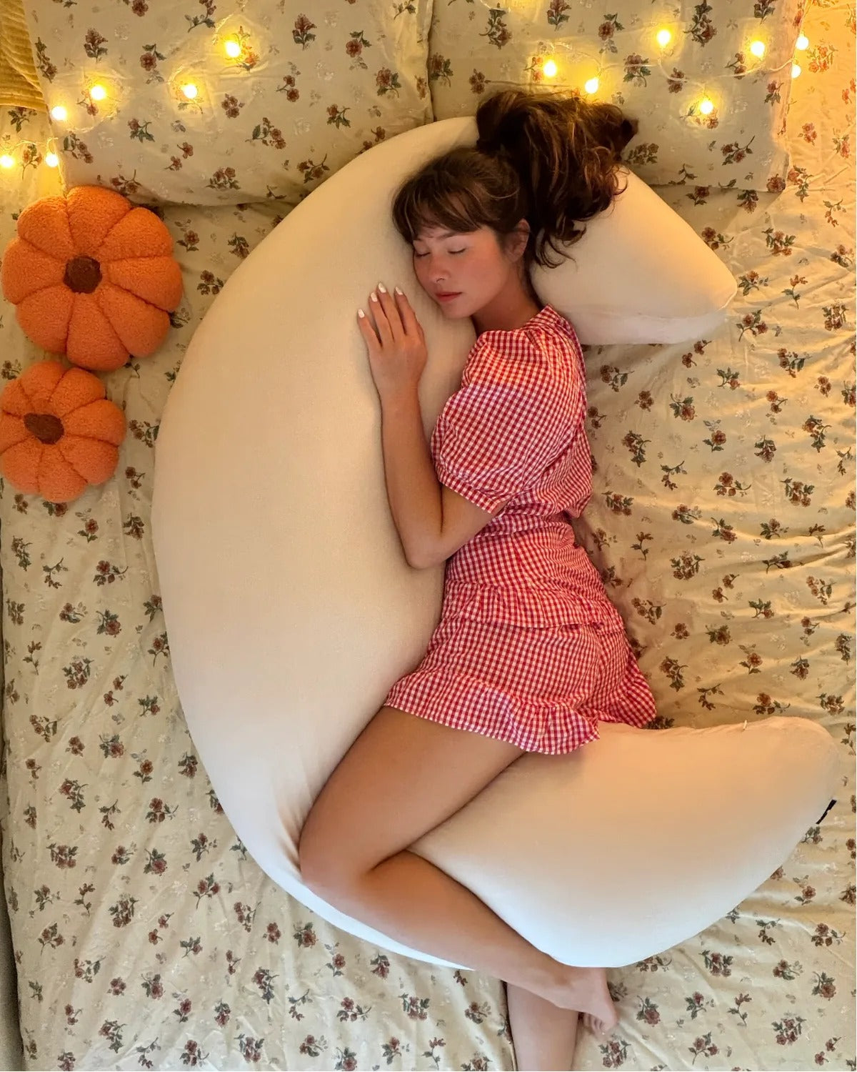 Side sleeper hugging cream crescent moon body pillow
